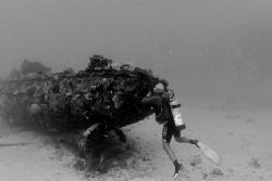 Dive Aruba's Clive Paula peeks inside a small tug wreck. ... by Matthew Shanley 